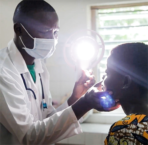 A doctor inspects a patient