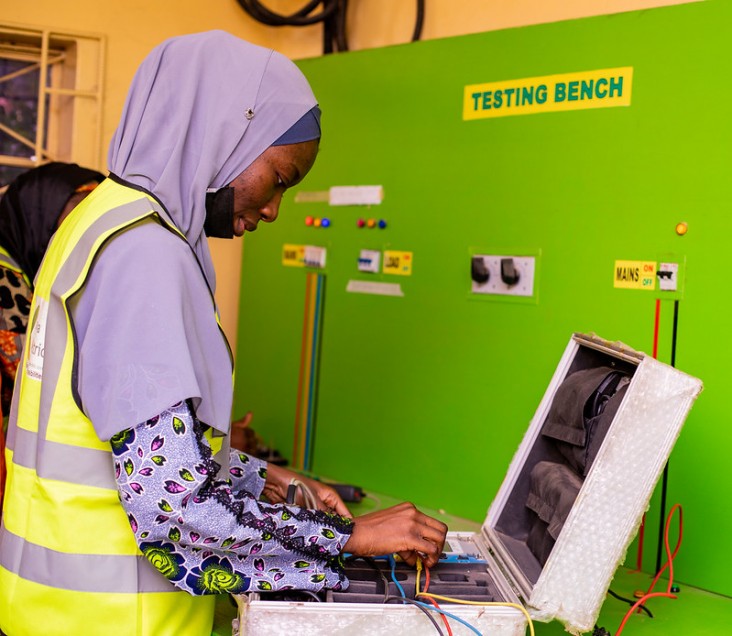 A technician at Kaduna Distribution Company tests a meter to ensure all distributed meters are in good working condition.