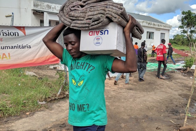 DAI victm taking home his belongings after receiving from USAID