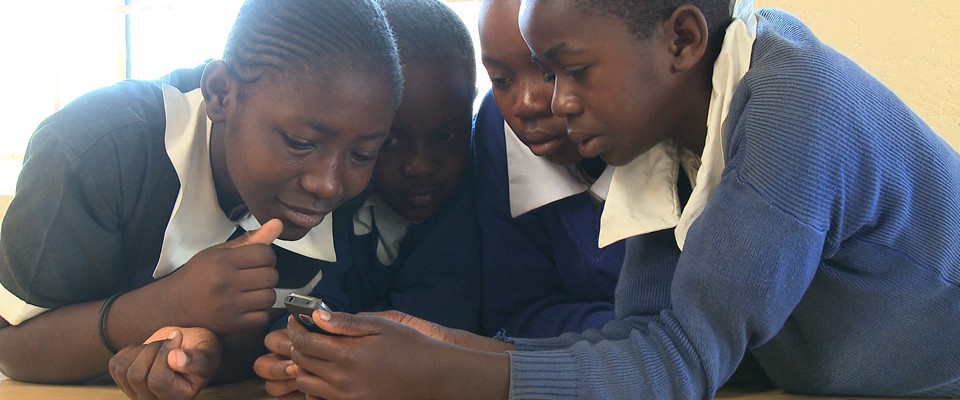 Children play a game on a device