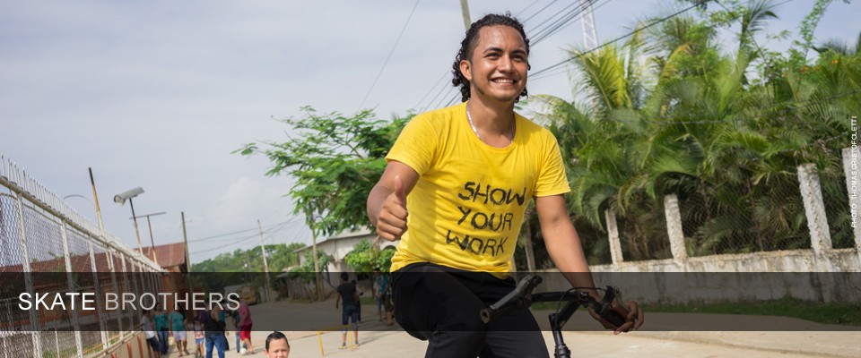 Jessel Edgardo Recinos rides a bike in the streets of Honduras