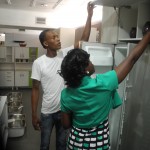 Shermon Bobb helps a customer 