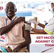 Man gets vaccinated against COVID-19 at a USAID-sponsored clinic