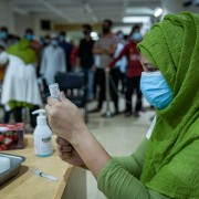 Image of vaccinator preparing Moderna COVID-19 vaccine in Bangladesh